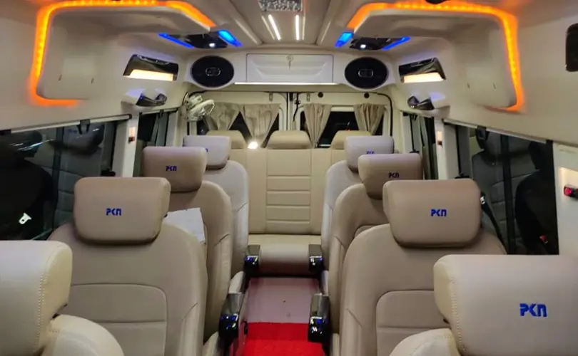 9 seater tempo traveller interior with cream leather seats
